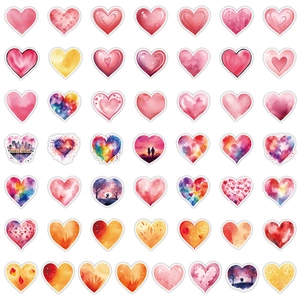 Detail view of colorful heart stickers with diverse artistic watercolor and landscape patterns