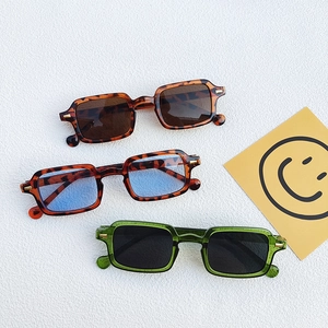 Three pairs of vintage square frame sunglasses in tortoise and transparent green colors