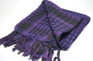 Detail of purple and black checkered tactical scarf with fringe on white background