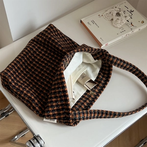 Retro houndstooth wool tote bag with blue and brown check pattern on white surface