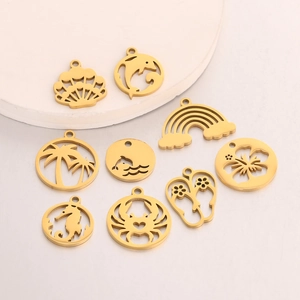 Golden stainless steel ocean theme charms including shells and dolphins for DIY jewelry