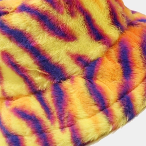 Plush faux fur bucket hat with vibrant yellow, orange, and purple tiger stripe patterns