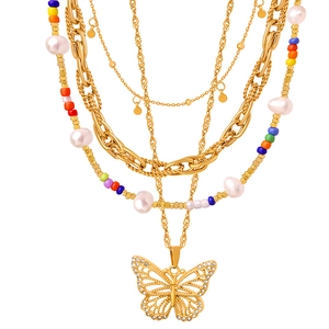 Bohemian gold layered necklace with pearl beads, woven chain and rhinestone butterfly pendant
