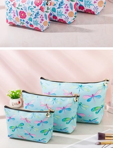 Detail of floral and dragonfly printed PU leather makeup bags with secure zipper closure