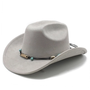Detail of light gray suede cowboy hat featuring woven black band and turquoise bead