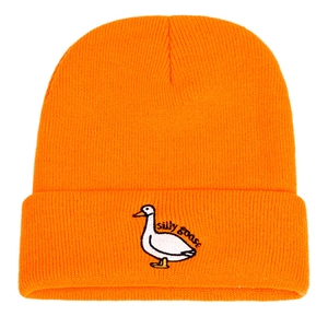 Detail of Silly Goose embroidery on orange ribbed knit beanie for winter warmth