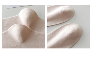 Detailed view of the reinforced heel and seamless toe construction on pink cotton socks