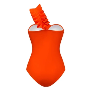 Detail of bright orange one-shoulder swimsuit with ruffled sleeve and elastic fabric
