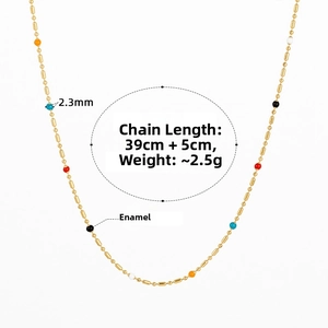 Detail view of colorful enamel beads on a thin gold stainless steel chain necklace