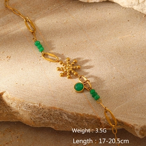 Detail of gold-plated sun pendant and green beads bracelet with weight and length specs