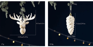 Detailed view of white and gold deer head and pine cone Christmas tree hanging ornaments