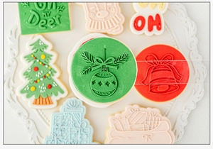 Detailed Christmas themed cookie cutters showing embossed deer and tree patterns