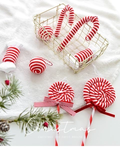 Detail of red and white striped knit plush Christmas candy and cane tree ornaments