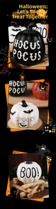 Detailed view of Halloween resin pumpkins with Hocus Pocus and Spooky motifs on wood bases