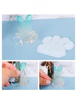 Detail of Christmas rabbit silicone mold with DIY resin finished phone stand