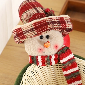 Christmas snowman storage basket with red plaid hat and knitted scarf for holiday candy