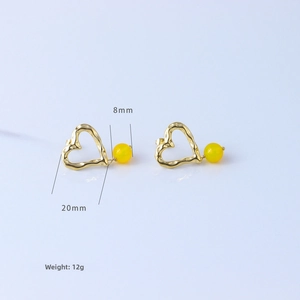 Macro shot of gold heart earrings with 8mm yellow beads and dimensions 20mm 12g
