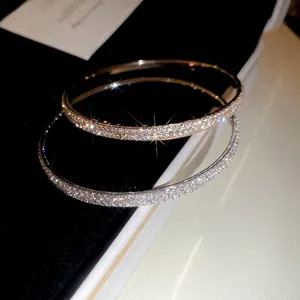Elegant gold and silver pavé crystal bangle bracelets with brilliant sparkling stones