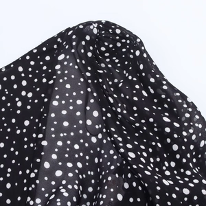 Summer black polka dot mini dress with pleated shoulder detail and chiffon fabric texture