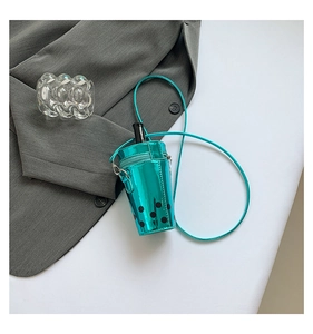 Detailed close-up of teal bubble tea cup crossbody bag with glossy patent leather finish
