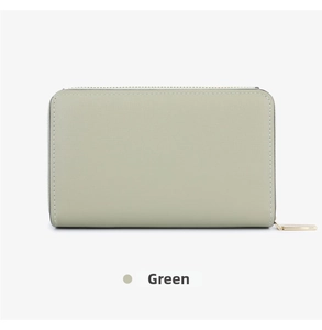 Close-up of short green multi-slot wallet featuring fine texture and gold zipper detail