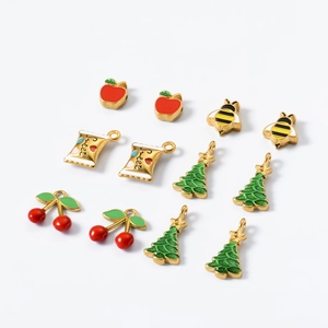 Colorful Christmas titanium steel pendants featuring apple, tree, and cherry designs
