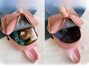 Pink corduroy mini backpack detail showing interior capacity for daily essentials