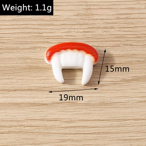Detailed view of a mini resin cartoon tooth charm with weight and size measurements