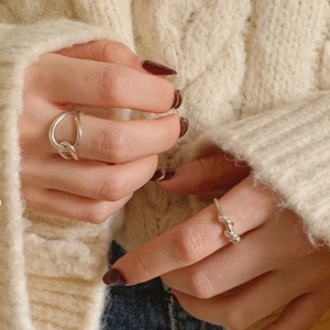 Minimalist 925 sterling silver spiral and irregular knot rings worn on finger