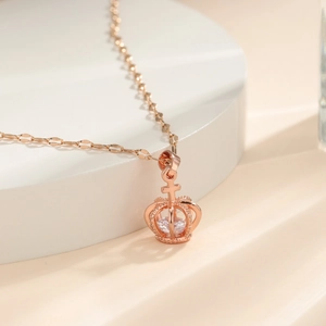 Rose gold hollow crown necklace with sparkling zircon pendant and delicate cross detail