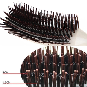Professional S-shaped hair teasing brush with multi-level bristles and cream handle
