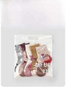 Detailanzeige der Verpackung von fünf Paar Kinder-Baumwollsocken mit Tiermustern