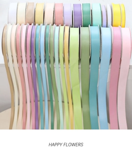 Close-up of matte cotton ribbons in various macaron colors with silk texture and sheen