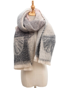 Close-up of geometric jacquard ginkgo leaf pattern on soft beige and pink knit scarf
