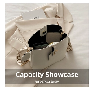 Top view showing the spacious interior and magnetic closure of the white bucket bag