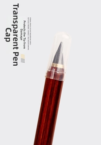 Close-up of the eternal pencil with wood grain barrel and clear tip protection cap