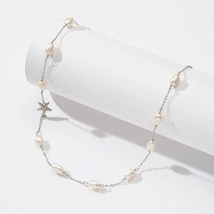 Macro shot of S925 sterling silver starfish pendant with lustrous freshwater pearls