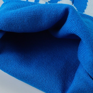 Close-up of the blue acrylic knit texture and high-quality woven fabric detail