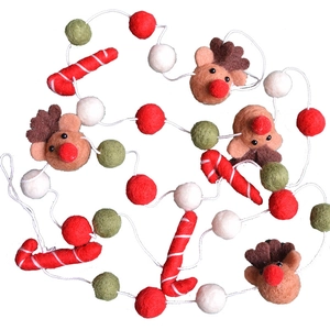 Handmade wool felt Christmas banner with reindeer, candy canes and colorful festive balls