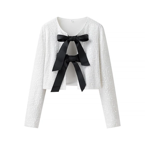 White sequined cropped cardigan with large black satin bows and long sleeves