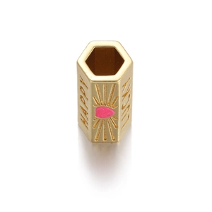Macro shot of gold-plated hexagonal charm with pink enamel heart and Lucky engraving