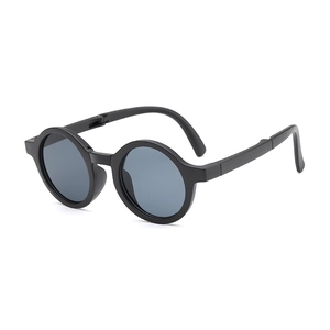 Foldable round kids sunglasses in matte black with UV protection and retro design