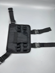 Tactical black oxford fabric leg panel with adjustable buckle straps and elastic loops
