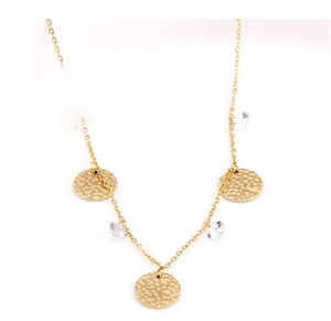 Macro detail of gold-plated stainless steel necklace with zircon and hammered pendant