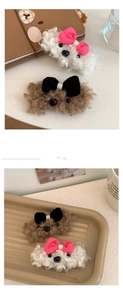 Detailed close-up of cute plush puppy hair clips in white and brown lamb wool
