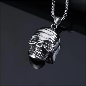 Oversized silver skull mask pendant necklace for men with punk style on black background