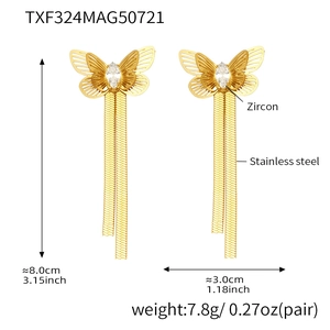 Detailed view of gold butterfly tassel earrings with zircon and stainless steel specs