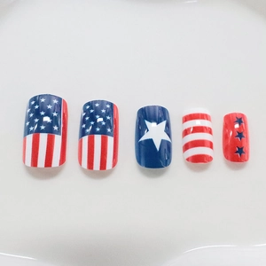 Glossy American flag style press-on nails with red blue color block stars and stripes