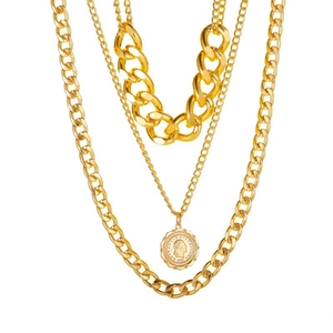 Close-up of gold layered necklace with triple chains and detailed coin portrait pendant