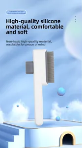 Detail of self-cleaning pet brush with metal needles for cats and dogs on blue stage